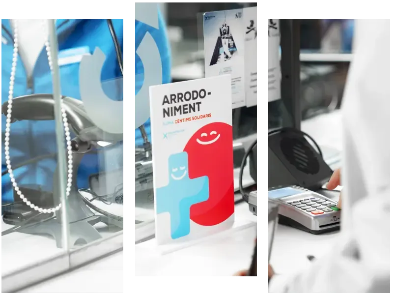 A person using a card reader at a service counter with a display of colorful brochures.